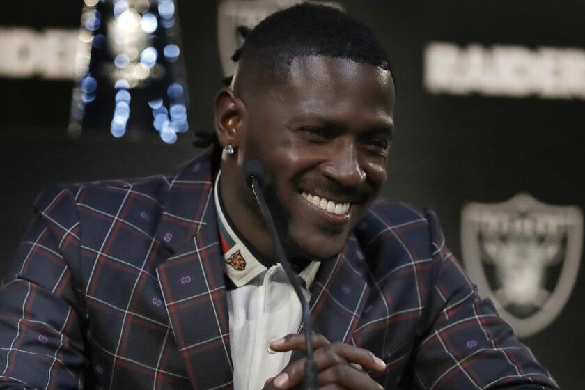 Oakland Raiders wide receiver Antonio Brown smiles during an NFL football news conference, Wednesday, March 13, 2019, in Alameda, Calif. (AP Photo/Ben Margot)