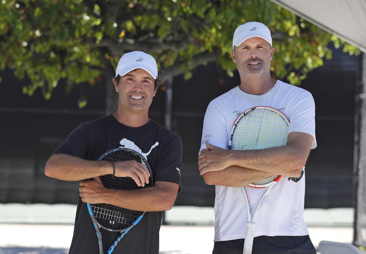 Owner Adrian Games, left, and co-owner Jimmy Johnson at the Advantage Tennis Academy.