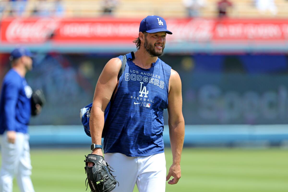 Dodgers pitcher Clayton Kershaw walks on the field at Dodger Stadium before a game.