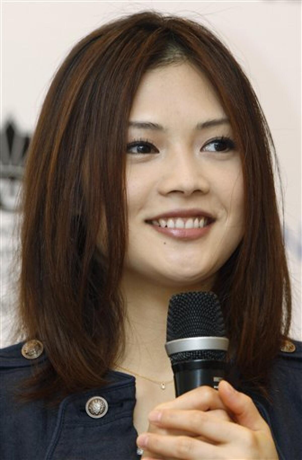 FILE - In this May 15, 2011 file photo, Japanese singer songwriter Yui speaks during a news conference in Hong Kong. The 24-year-old pop star played to a packed house at the 14,000-seat AsiaWorld-Expo Arena on Hong Kong's outlying Lantau Island late Sunday, June 26, 2011. (AP Photo/Kin Cheung, File)