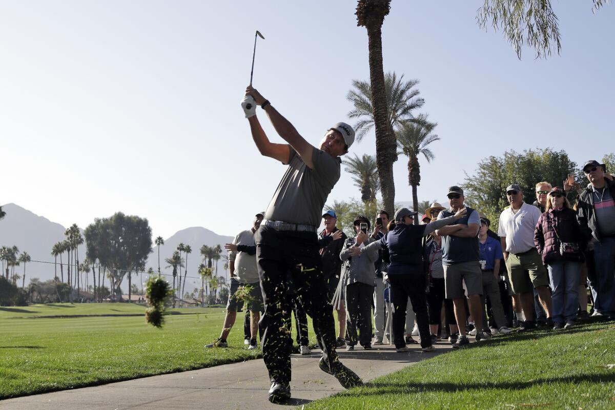 Phil Mickelson hits from the rough on the fourth hole during the first round of the American Express golf tournament at La Quinta Country Club on Jan. 16, 2020.