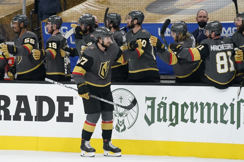 Vegas Golden Knights defenseman Shea Theodore (27) celebrates after scoring against the Montreal Canadiens during the first period in Game 1 of an NHL hockey Stanley Cup semifinal playoff series Monday, June 14, 2021, in Las Vegas. (AP Photo/John Locher)