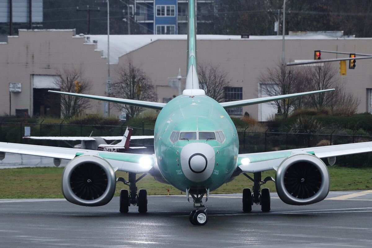 FILE - In this Dec. 11, 2019, file photo, a Boeing 737 Max airplane being built for Norwegian Air International turns as it taxis for take off for a test flight at Renton Municipal Airport in Renton, Wash. Boeing faces a growing checklist of items it could be forced to fix before federal safety officials let the grounded 737 Max airliner fly again. The Federal Aviation Administration recently asked Boeing to review all possible ramifications of the changes it is making on the plane. (AP Photo/Ted S. Warren, File)