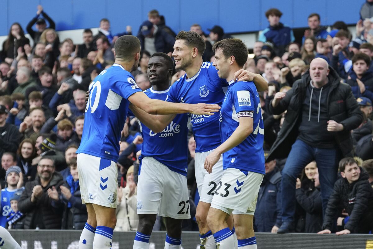 Everton's James Tarkowski, second right, celebrates with teammates after scoring his side's opening goal during the English Premier League soccer match between Everton and Arsenal at Goodison Park in Liverpool, England, Saturday, Feb. 4, 2023. (AP Photo/Jon Super)