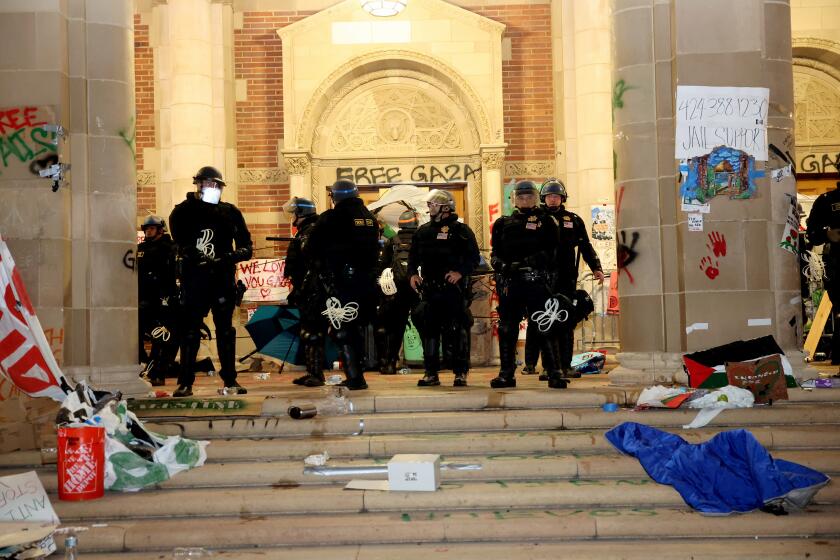 LOS ANGELES CA MAY 2, 2024 -- Police at one of the buildings on the UCLA campus Thursday, May 2, 2024. (Jason Armond / Los Angeles Times)