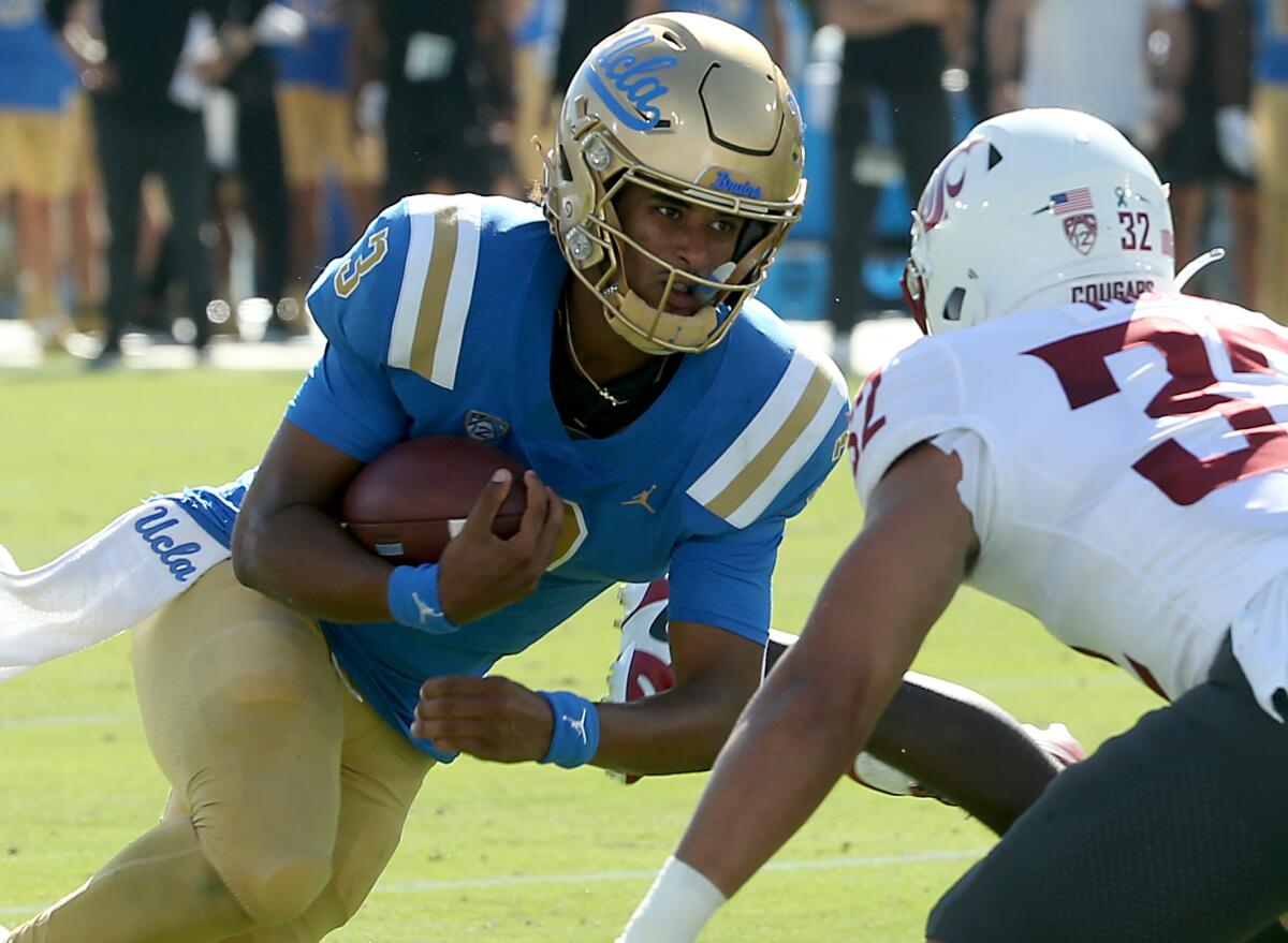 UCLA quarterback Dante Moore runs the ball against Washington State on Oct. 7
