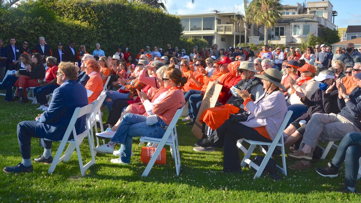 About 300 people attended the Stop Gun Violence rally held Saturday night at Eisenhower Park in Seal Beach.