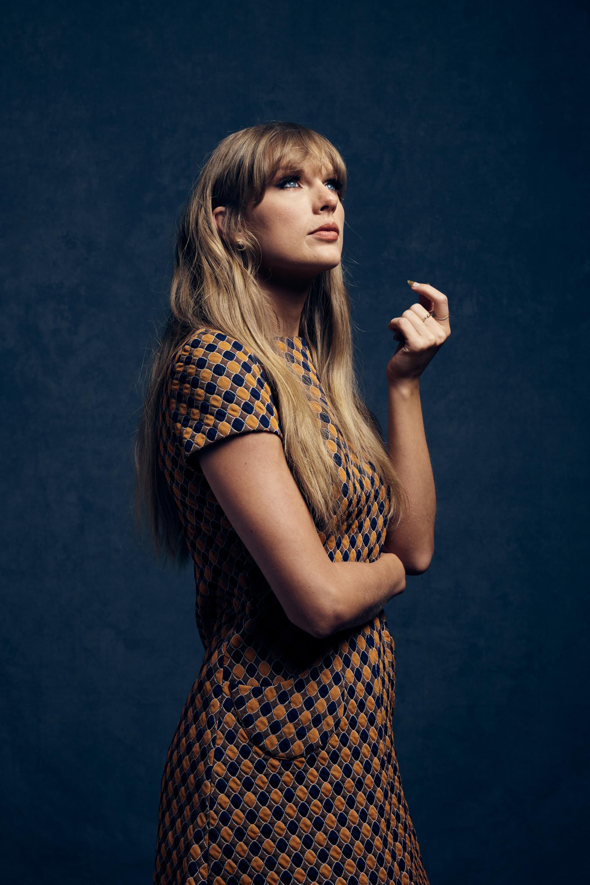 Woman standing in a patterned dress