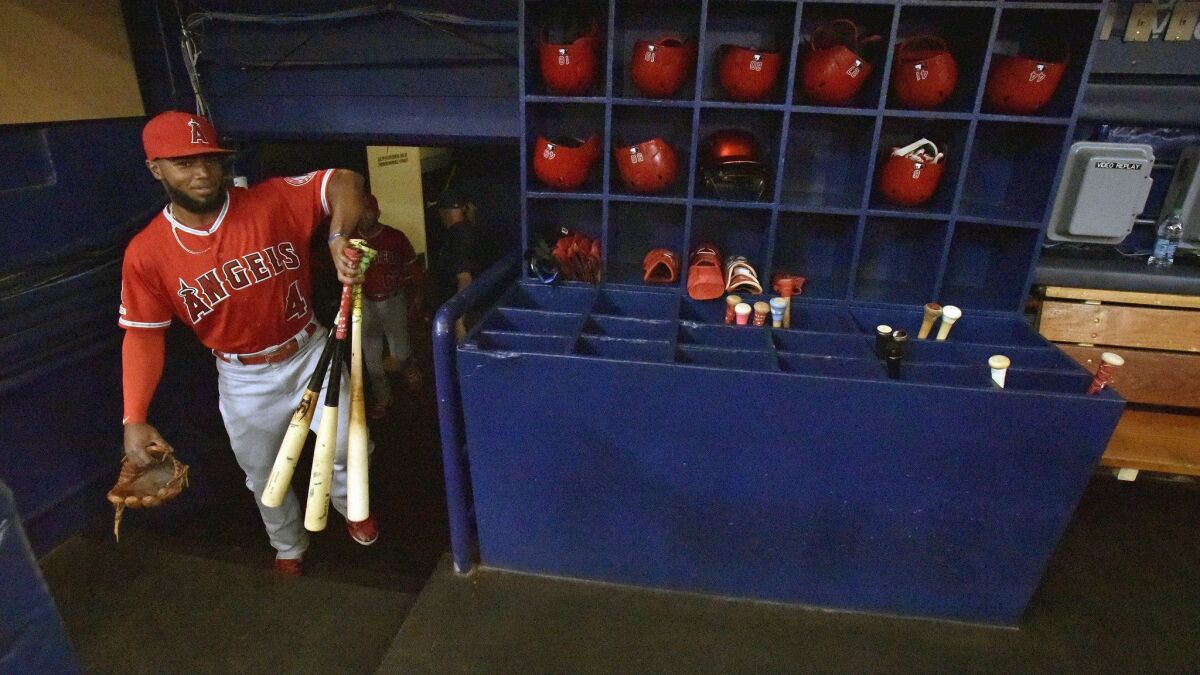 Luis Rengifo carries his gear into the dugout before a game against the Tampa Bay Rays on June 15.