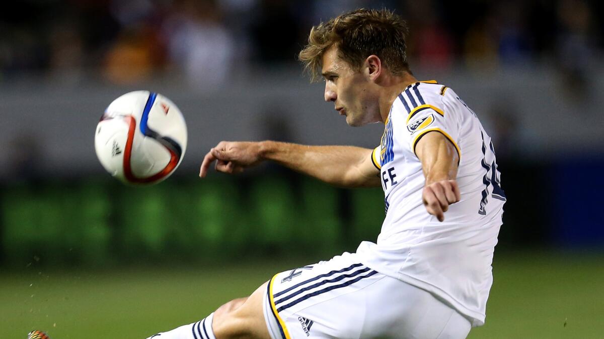 Galaxy midfielder Robbie Rogers clears the ball during a 2-0 win over the Chicago Fire on March 6.