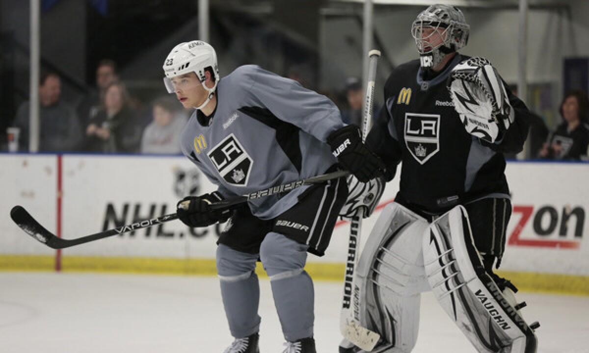 Kings teammates Dustin Brown, left, and Jonathan Quick were named to the U.S. Olympic hockey team on Wednesday.