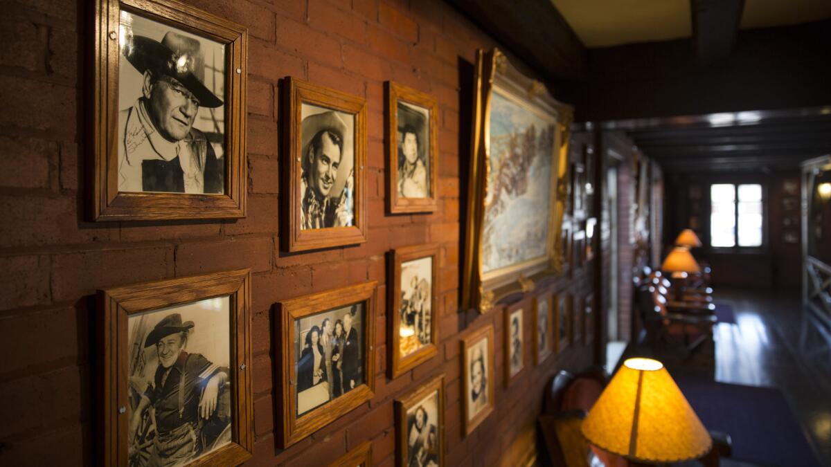 El Rancho Hotel in Gallup has walls lined photos of celebrity guests. (Brian van der Brug / Los Angeles Times)