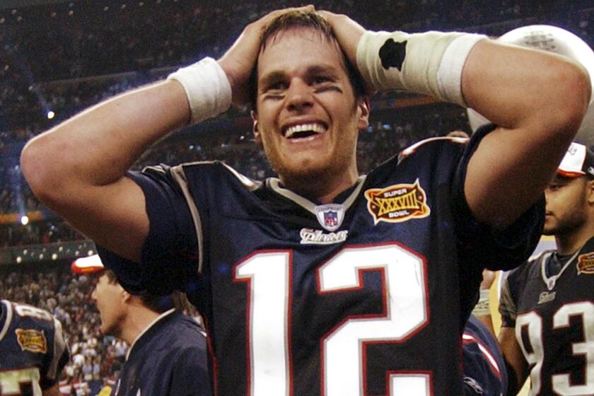 New England Patriots quarterback Tom Brady celebrates after beating the Carolina Panthers in Super Bowl XXXVIII in February 2004. Brady has won four Super Bowl titles -- including XXXVI, XXXIX and XLIX -- to join Terry Bradshaw and Joe Montana in elite company.