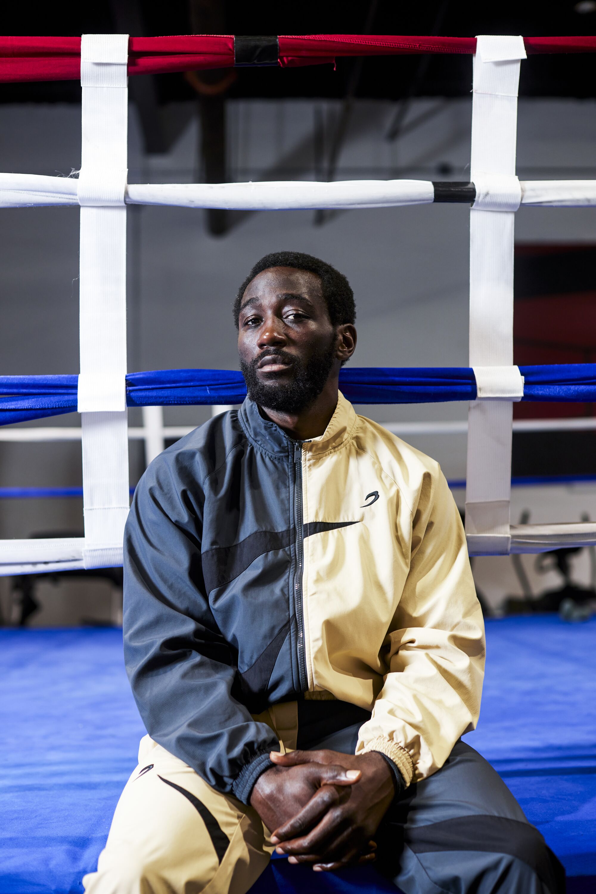 Terence "Bud" Crawford sits on the edge of the ring before a training session at the Triple Threat Boxing Gym 