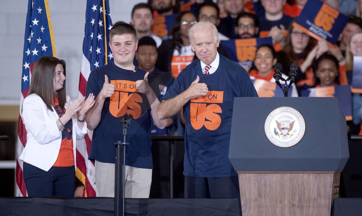Vice President Joe Biden shows a T-shirt he received from student leaders at the University of Illinois in Urbana on April 23, part of an effort to reduce sexual assaults on college campuses.