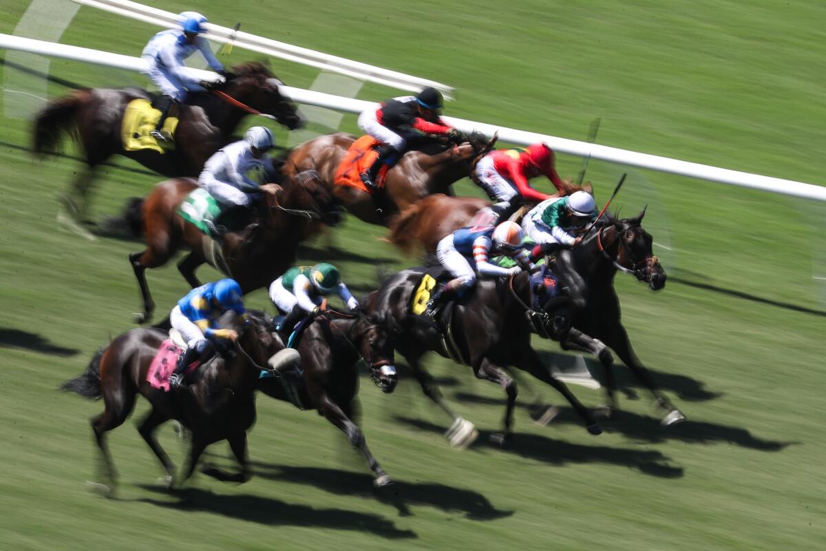 Horses run on the turf during the second race of Opening Day at the Del Mar Thoroughbred Club on July 21.