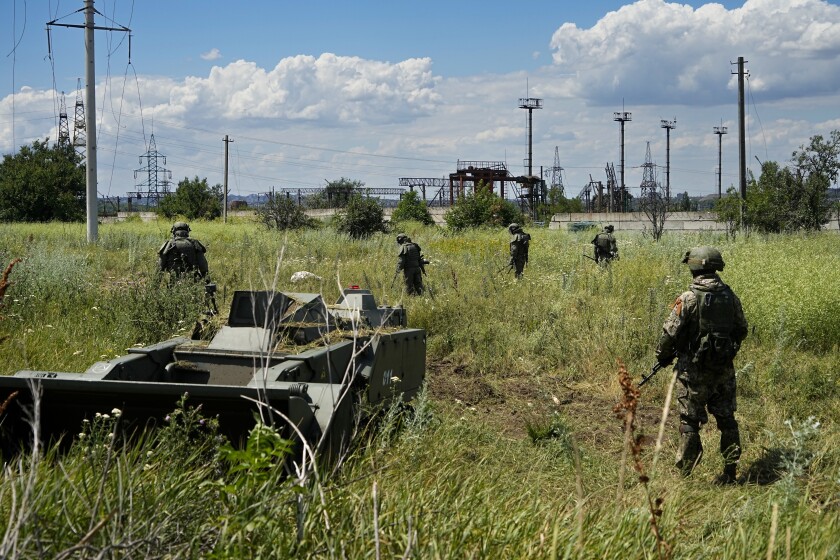 Russian mine-clearing experts in a field