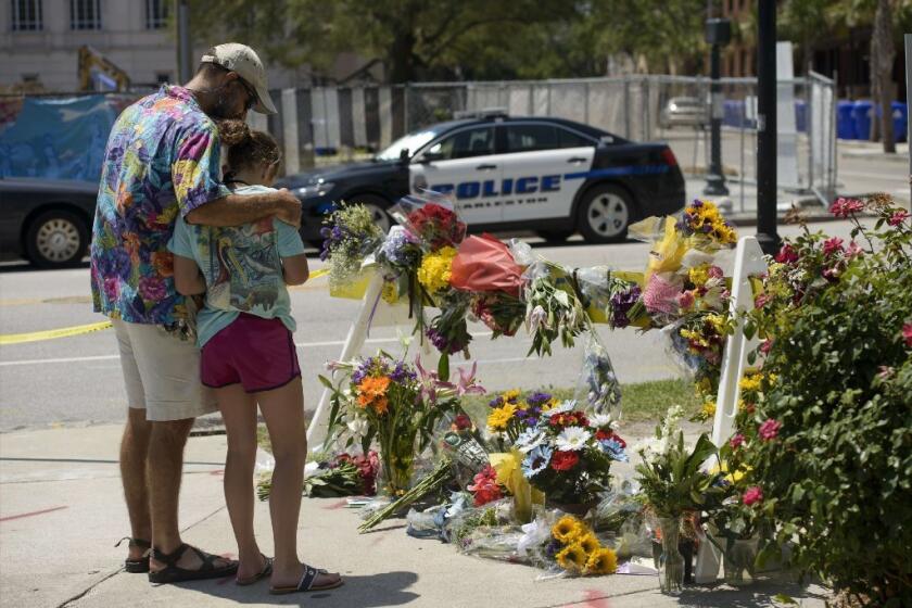 Mourners gather before a makeshift memorial near the Emanuel AME Church in Charleston, S.C. Mass shootings like the one in Charleston have become more common in the U.S. since 2011.