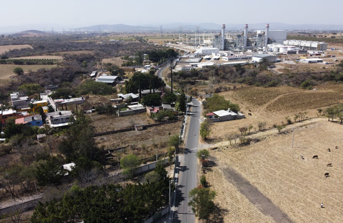 An aerial photo shows a power plant against a skyline