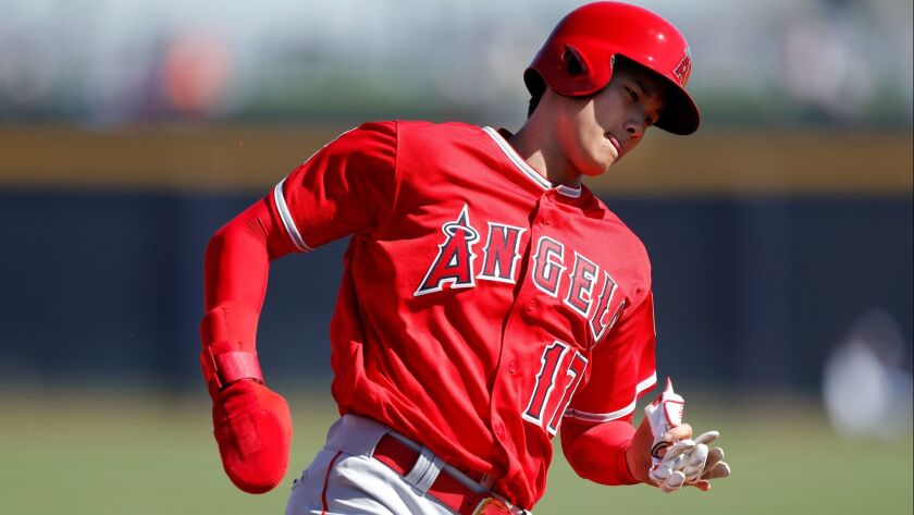 The Angels' Shohei Ohtani runs to third base during the third inning of a spring training baseball game against the San Diego Padres, Monday, Feb. 26, 2018, in Peoria, Ariz.