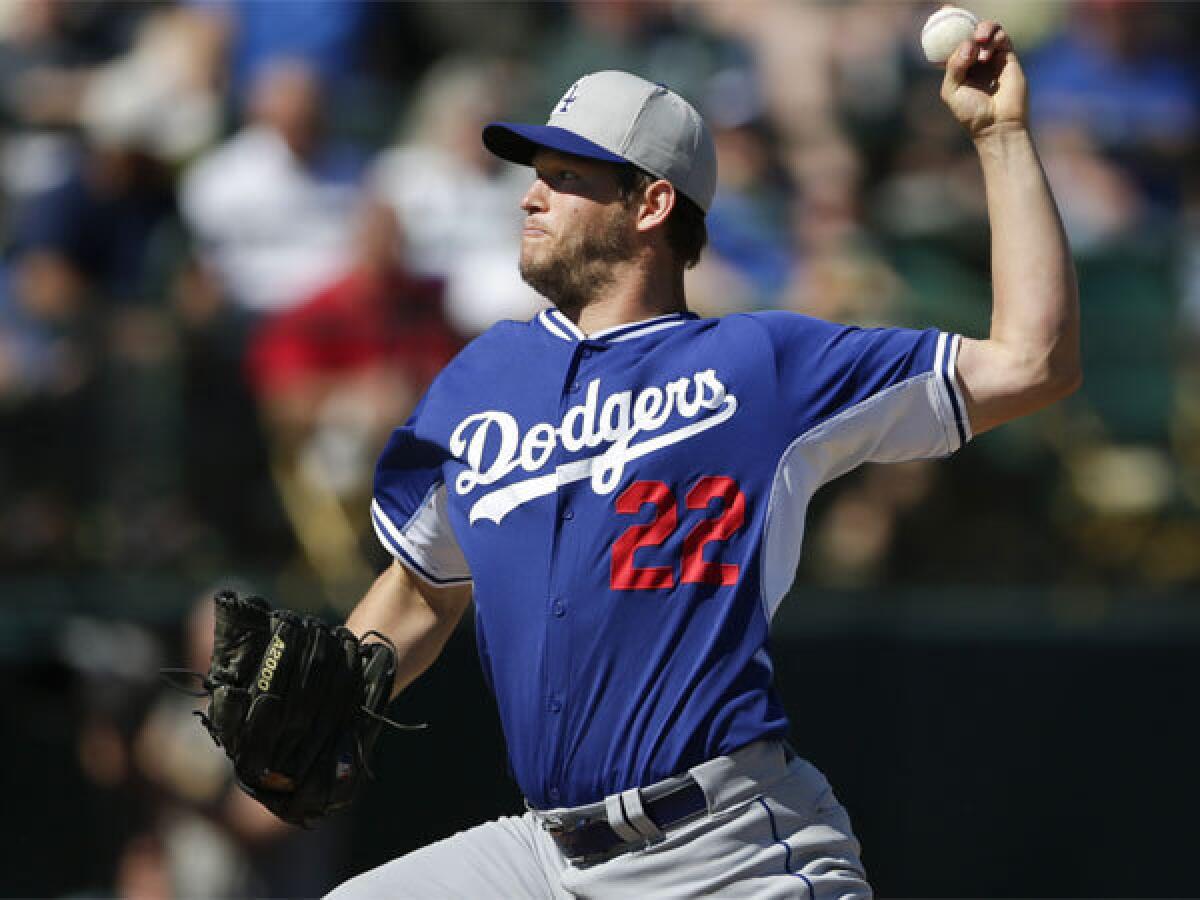 Dodgers ace Clayton Kershaw throws against the Oakland A's during a spring training game on Tuesday.