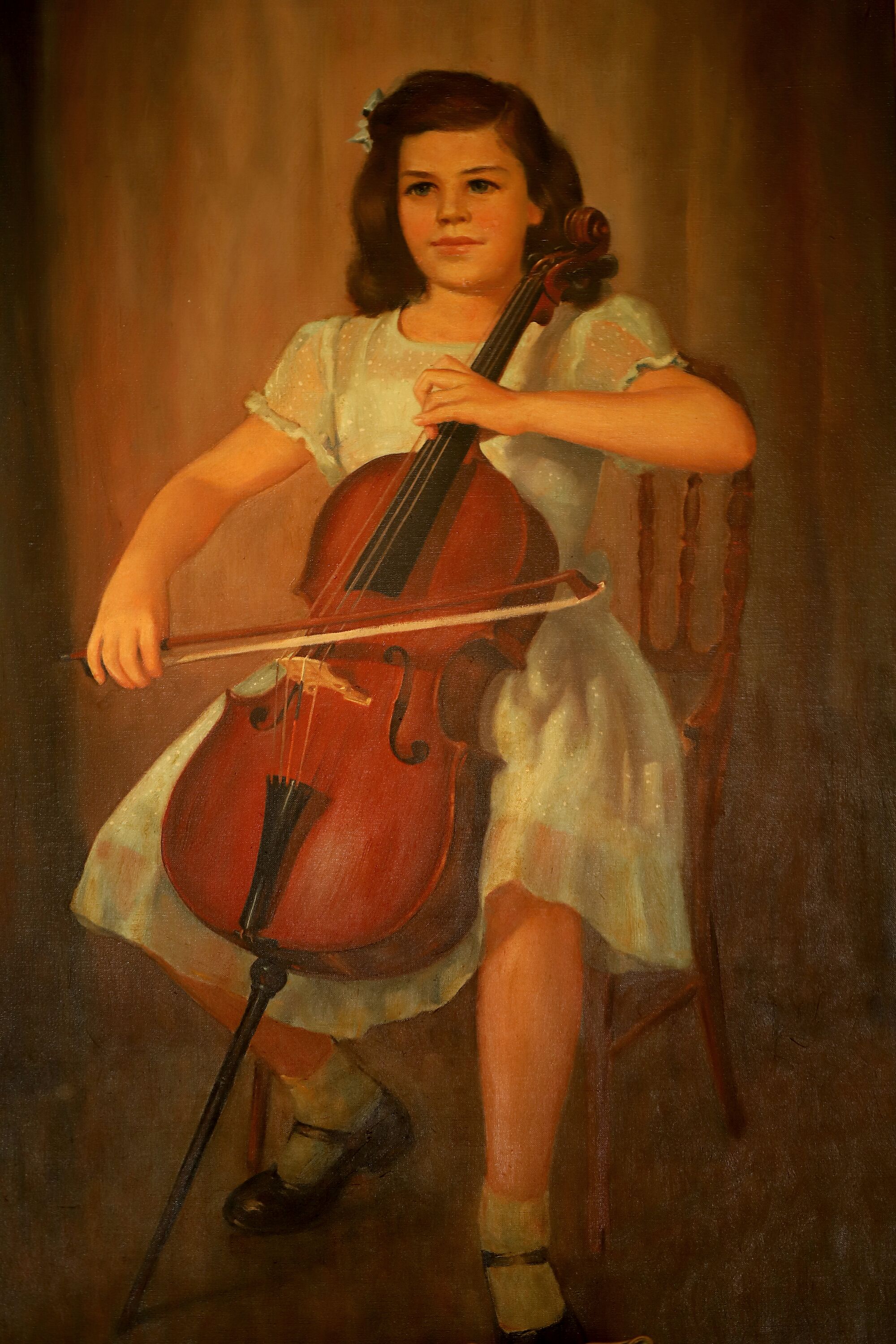  A painting of 8-year-old Christine playing the cello.