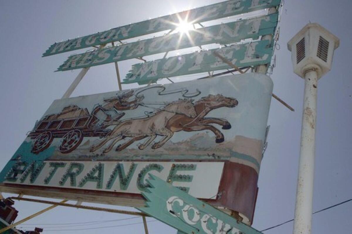 The Wagon Wheel sign stands as it did when residents brought their guests for thick steaks and visitors enjoyed cocktails on the barrooms cowhide seats.