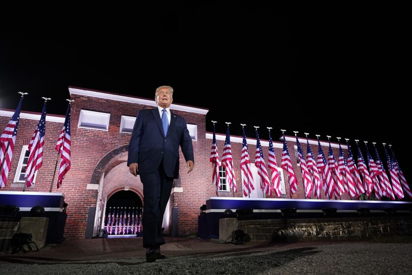 President Donald Trump walks to the stage after Vice President Mike Pence delivered a speech on the third day of the Republican National Convention at Fort McHenry National Monument and Historic Shrine in Baltimore, Wednesday, Aug. 26, 2020. (AP Photo/Andrew Harnik)