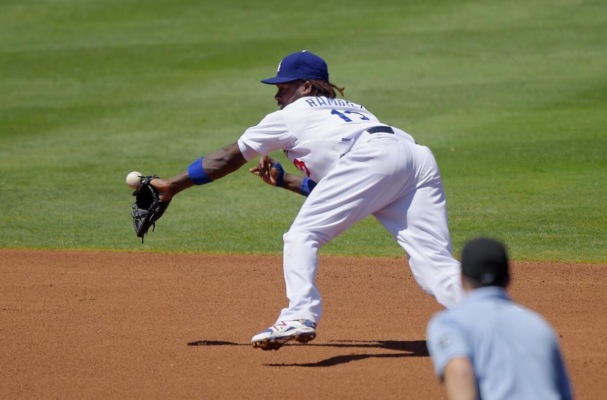Hanley Ramirez has trouble getting hold of a ball hit by New York's David Wright during the third inning of the Dodgers' 11-3 loss to the Mets on Aug. 24 at Dodger Stadium.