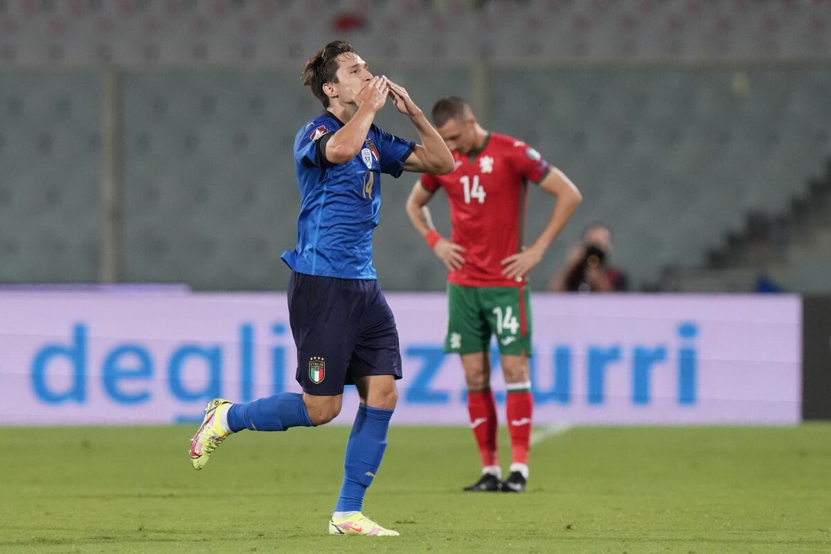Italy's Federico Chiesa celebrates after scoring his side's opening goal during the World Cup 2022 qualifier group c soccer game between Italy and Bulgaria at the Artemio Franchi stadium in Florence, Italy, Thursday, Sept. 2, 2021. (AP Photo/Luca Bruno)