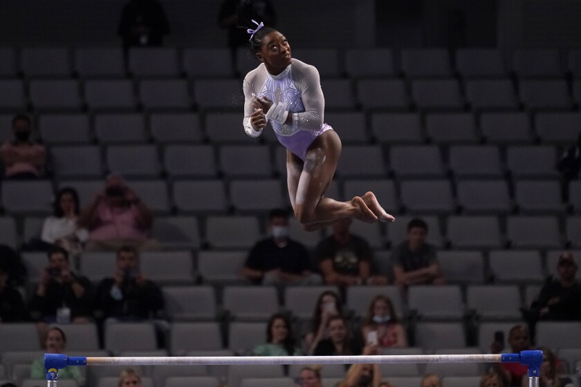 Simone Biles competes on the uneven bars at the U.S. Gymnastics Championships in Fort Worth, Texas, on Friday.