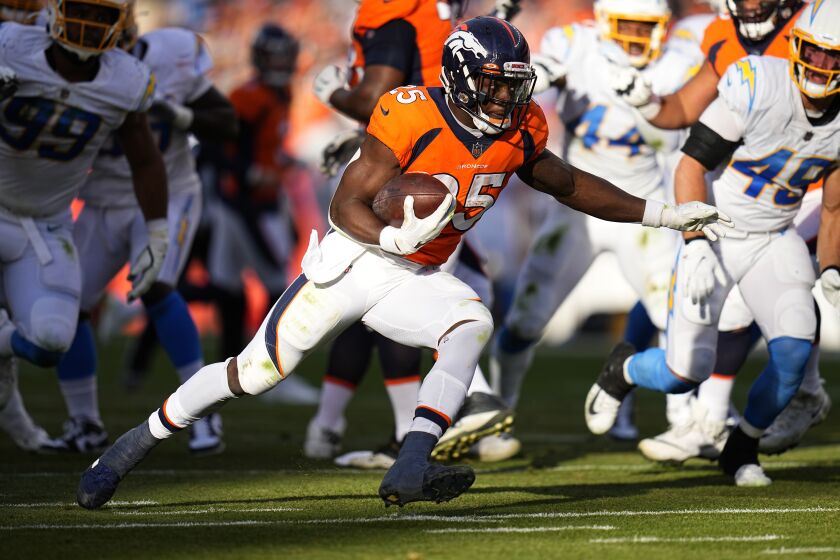Denver Broncos running back Melvin Gordon (25) against the Los Angeles Chargers during the first half of an NFL football game, Sunday, Nov. 28, 2021, in Denver. (AP Photo/Jack Dempsey)