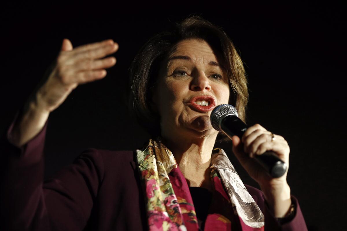 Sen. Amy Klobuchar (D-Minn.) speaks into a microphone