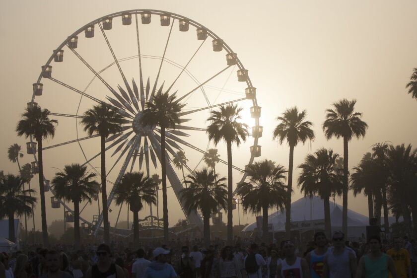 On the second day of the Coachella Valley Music and Arts Festival a sold partied in windy dusty weather. In the early afternoon, the wind picked up, stirring dust into the air Saturday.