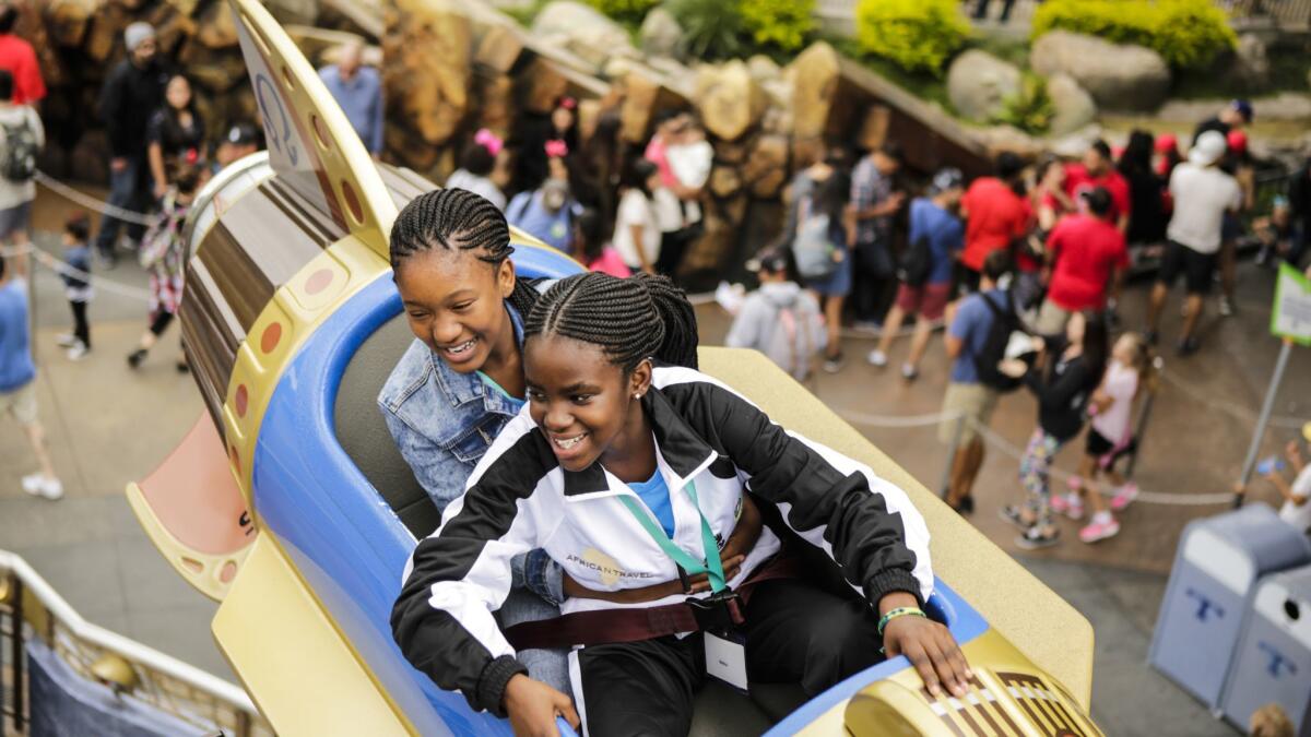 Amy Foundation singers Phelokazi Mkalipi(left) and Nelisa Ntlokomfana experience their first ride at Disneyland.