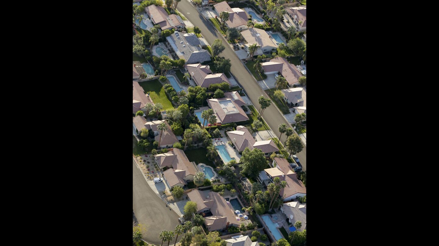 Homes with swimming pool line the streets of this neighborhood in Palm Springs.