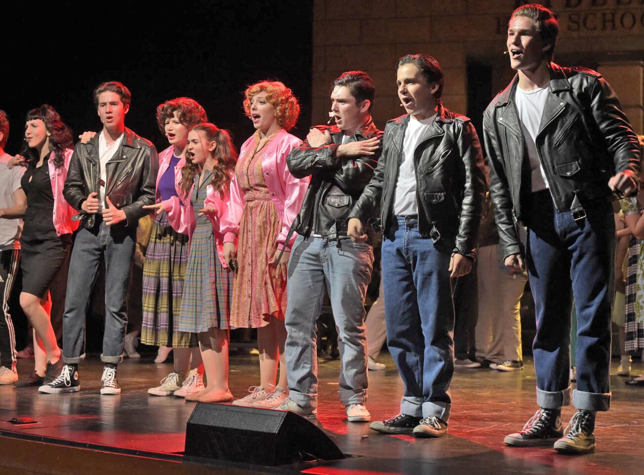 The "T-Birds" and the "Pink Ladies" sing "Summer Nights" during the rehearsal of "Grease" at John Burroughs High School on Tuesday.