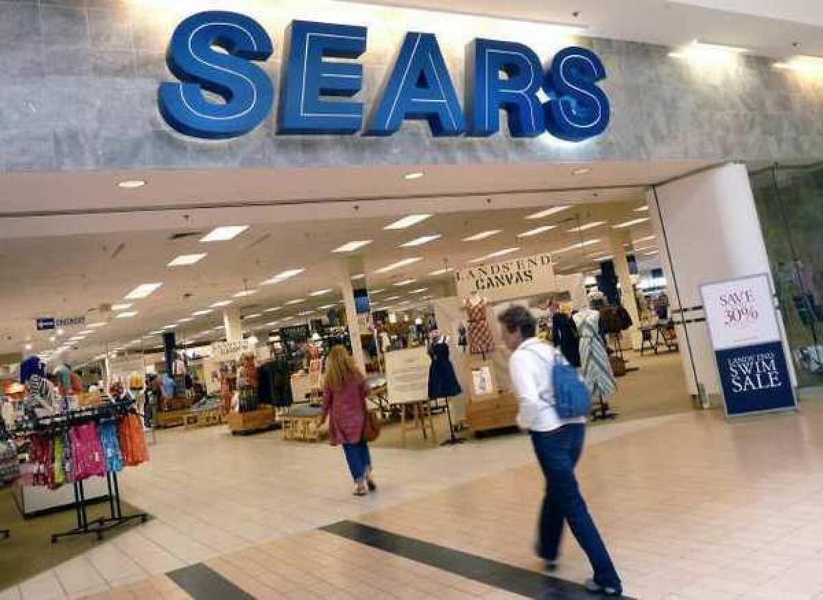 Sears Holdings Corp. said it's reducing its stake in its Canada business and reported a profit in the first quarter.
