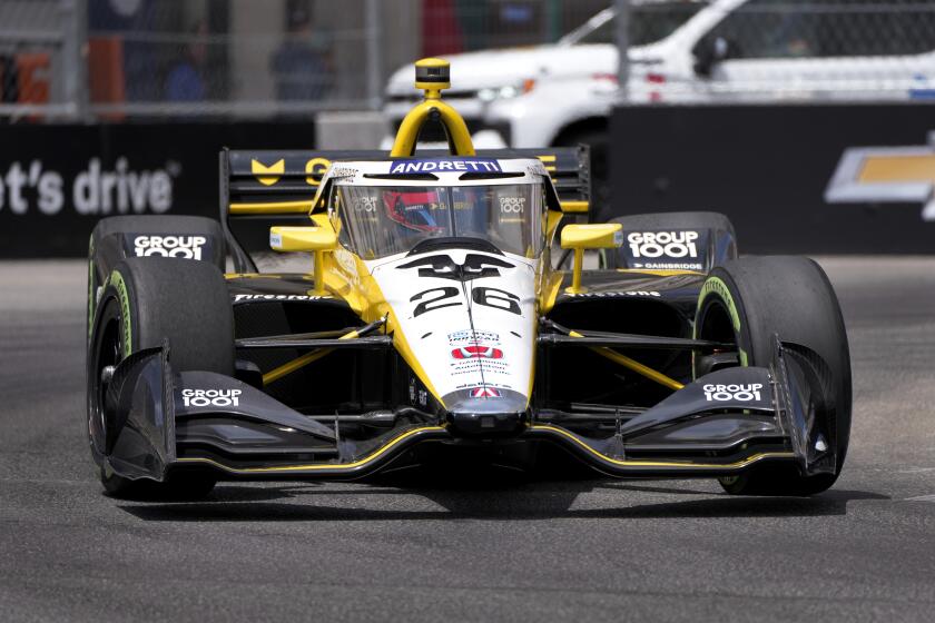 Colton Herta (26) drives during qualifications for the IndyCar Detroit Grand Prix auto race in Detroit, Saturday, June 1, 2024. (AP Photo/Paul Sancya)