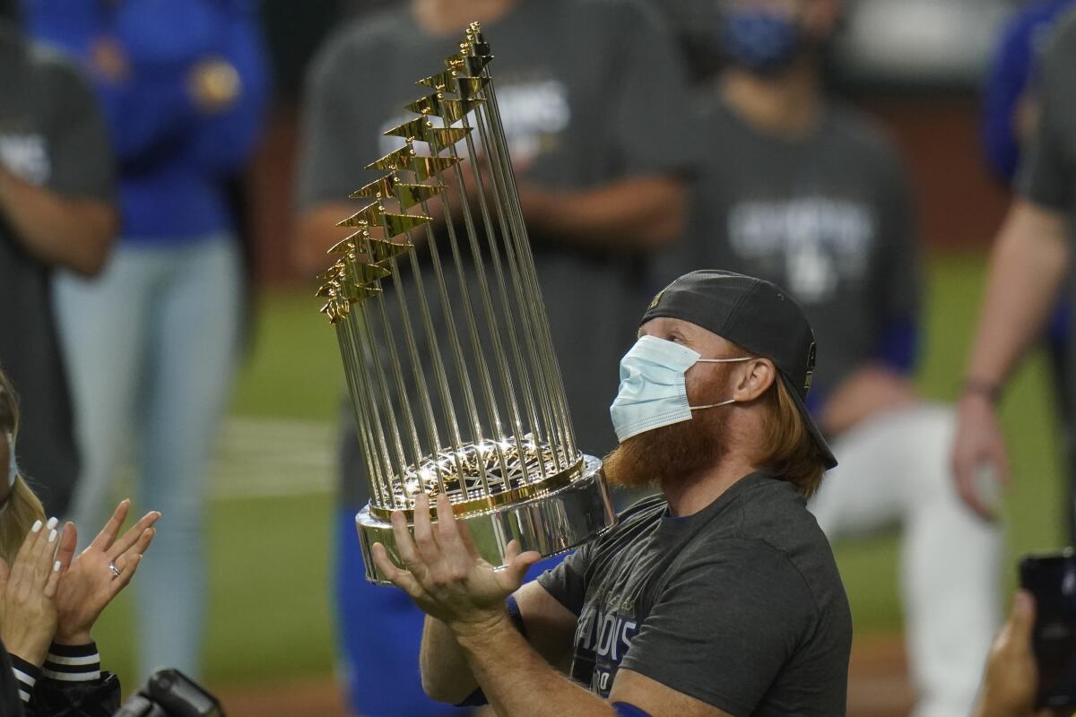 Dodgers third baseman Justin Turner celebrates on the field with the World Series trophy on Oct. 27.