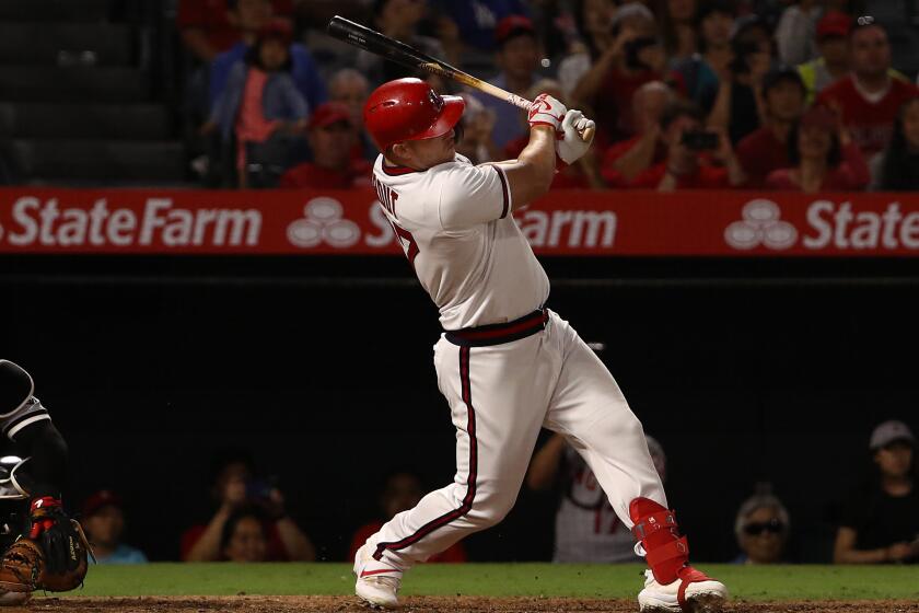 ANAHEIM, CALIFORNIA - AUGUST 17: Mike Trout #27 of the Los Angeles Angels drives in two runs with a single to left field in the seventh inning of the MLB game against the Chicago White Sox during the MLB game at Angel Stadium of Anaheim on August 17, 2019 in Anaheim, California. (Photo by Victor Decolongon/Getty Images)