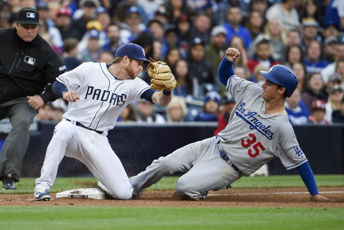 Dodgers rookie Cody Bellinger steals third base before San Diego's Cory Spangenberg can apply the tag during a game May 6 at Petco Park.