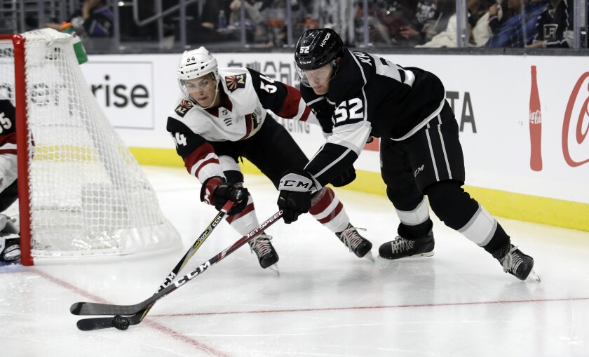 Kings' Arthur Kaliyev, right, defended by Arizona Coyotes' Cam Dineen
