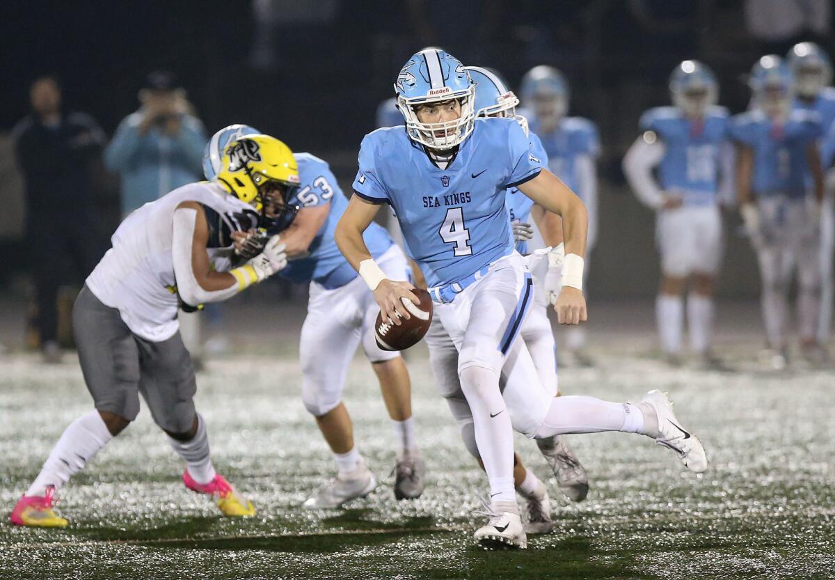 Corona del Mar quarterback Ethan Garbers runs out of trouble during the quarterfinals of the CIF Southern Section Division 3 playoffs against Cajon on Saturday at Davidson Field.
