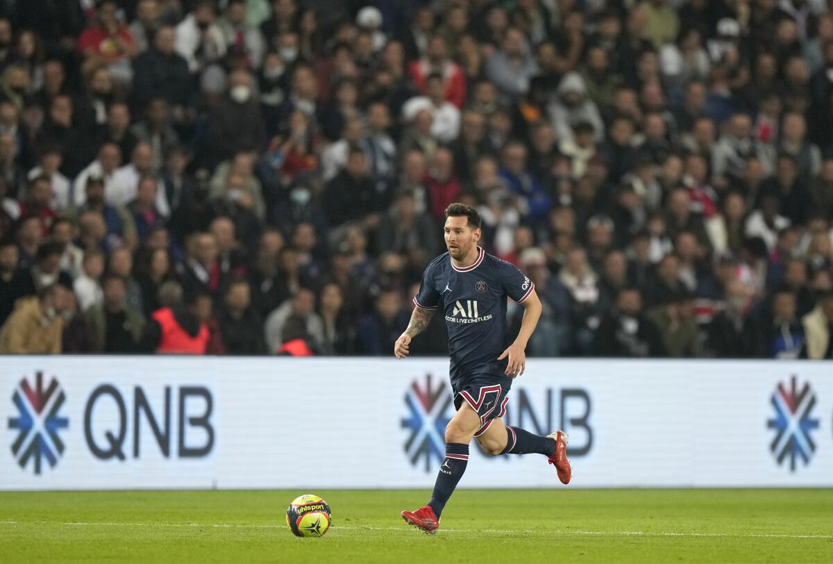 PSG's Lionel Messi controls the ball during a French League One match 
