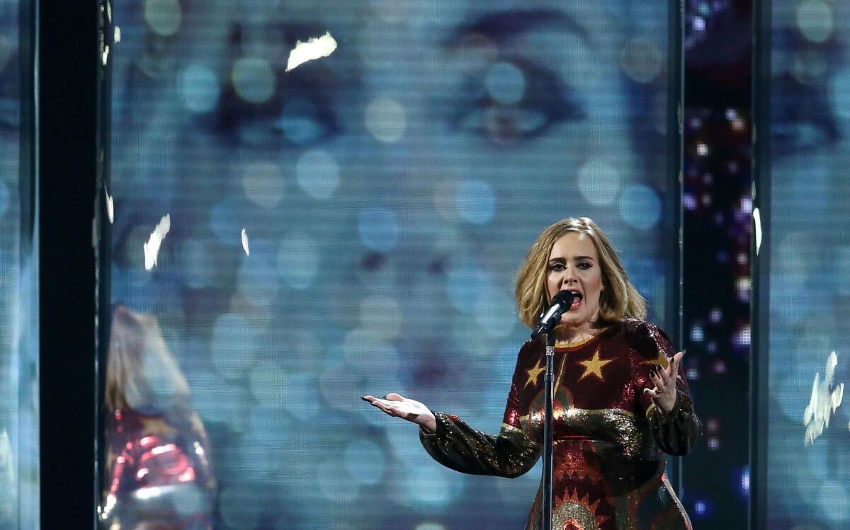 Adele performs during the Brit Awards in London on February 24, 2016.