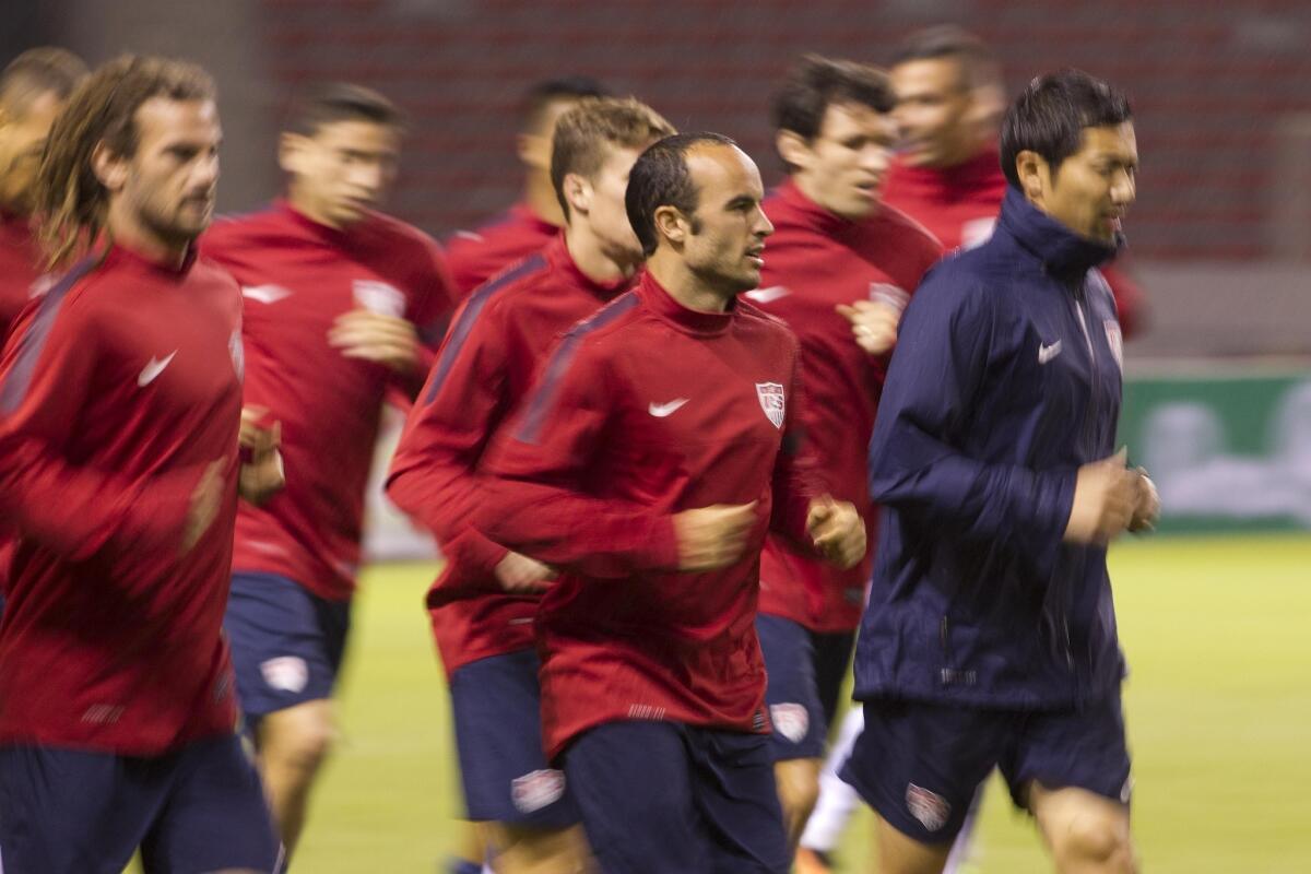 Landon Donovan and his U.S. soccer teammates run during a training session Thursday ahead of their 2014 World Cup qualifying soccer match with Costa Rica on Friday night in San Jose, Costa Rica.