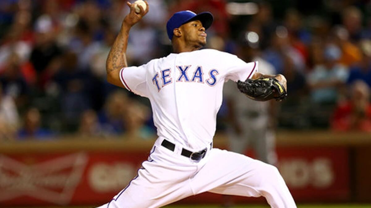 Former Rangers right-hander Lisalverto Bonilla delivers a pitch last season during a game against the Astros.