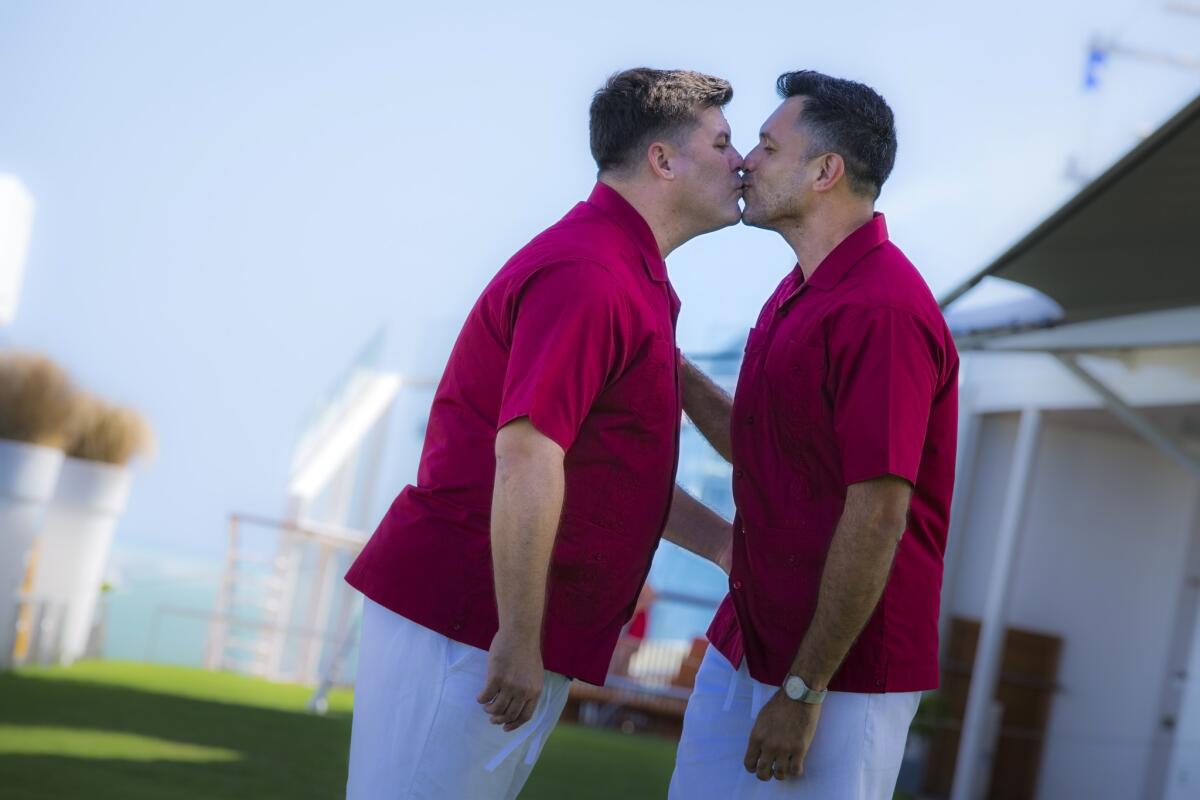 Ben Gray, left, and Francisco Vargas became the first same-sex couple to be legally married at sea Jan. 29 this year aboard Celebrity Equinox.