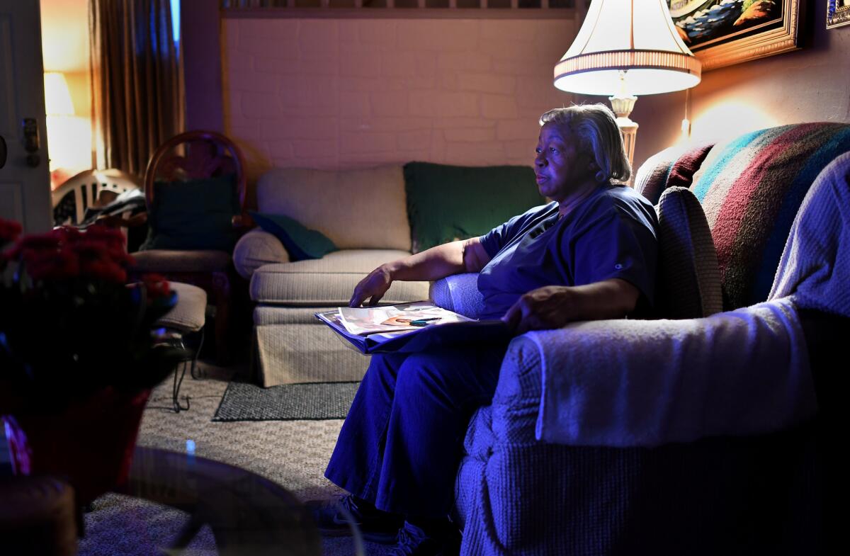 Wanda Reaves sits in the living room of her Akron home where she once provided shelter for LeBron James and his mother.